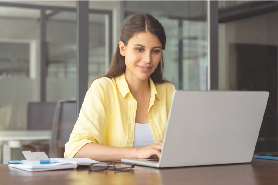 Woman working on her computer in a her office.
